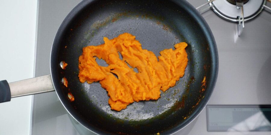 Caramelized onions, carrots, garlic, and ginger in frying pan.