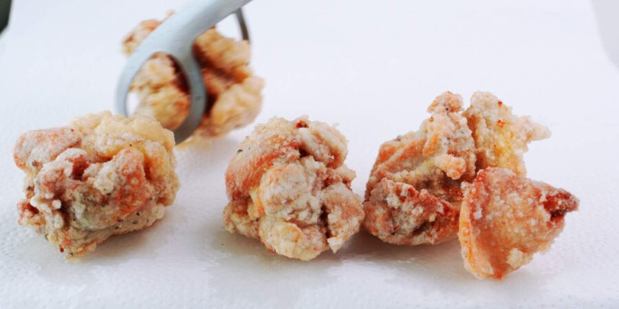 Draining karaage on paper towels.