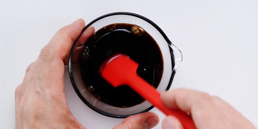 Mixing soba salad dressing.
