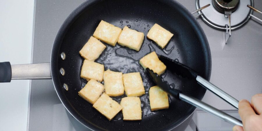 Pan-frying tofu.