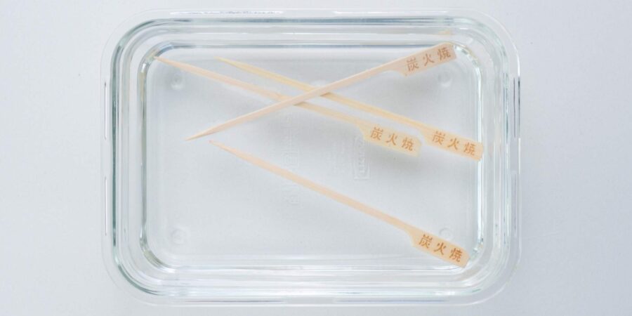 Soaking skewers in water.