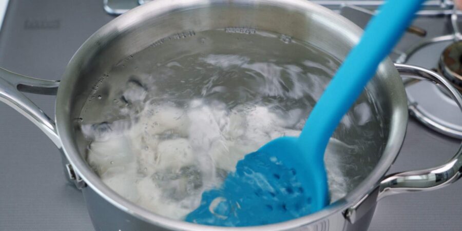 Boiling dango in a pot.