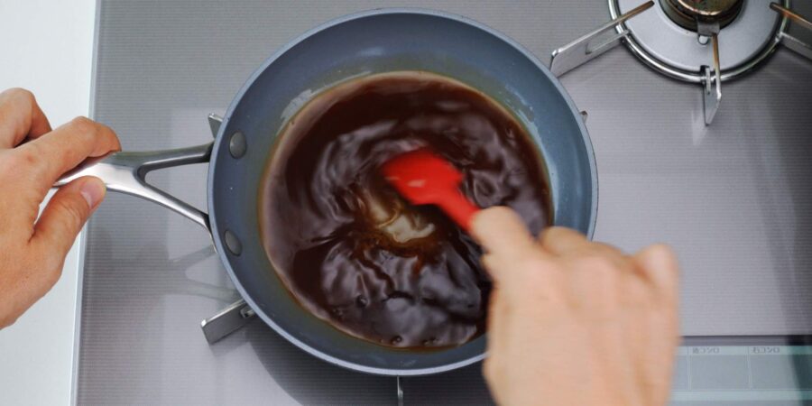 Mixing Mitarashi Dango Sauce ingredients together in a pan.