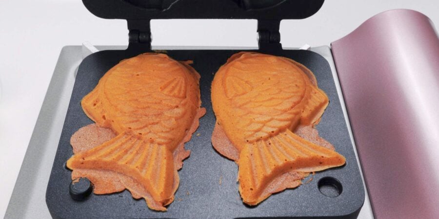 Golden brown taiyaki in a mold.