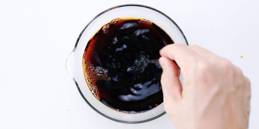 Mixing sugar and soy sauce together.