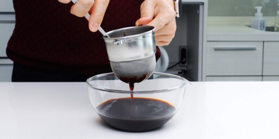Straining Japanese dashi soy sauce.