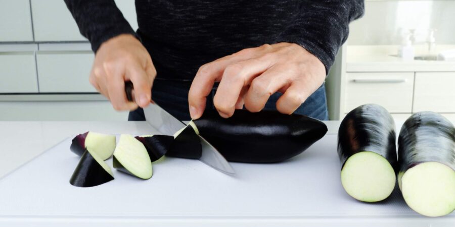 Cutting up Japanese eggplant for Mapo Eggplant.