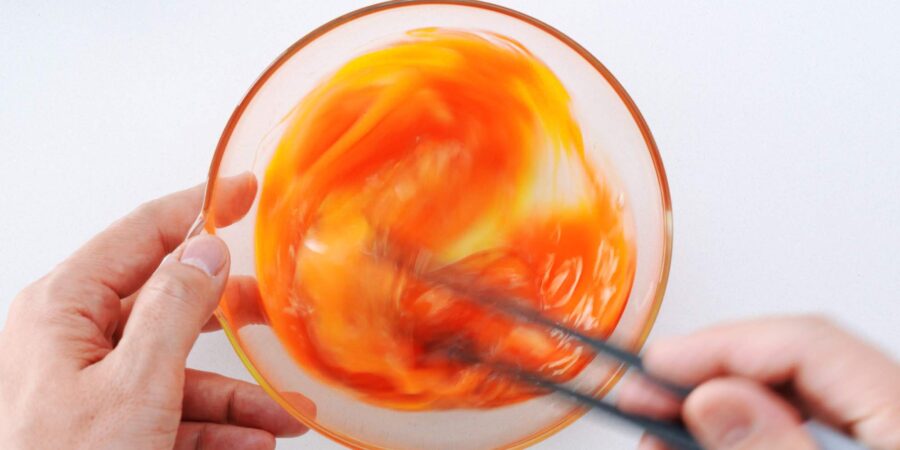 Beating eggs with soy sauce.