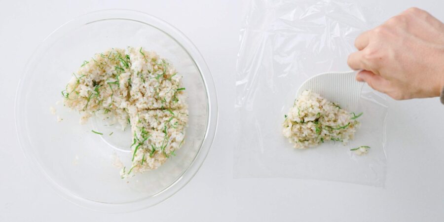 Add a quarter of the rice to a sheet of plastic wrap to shape the onigiri.