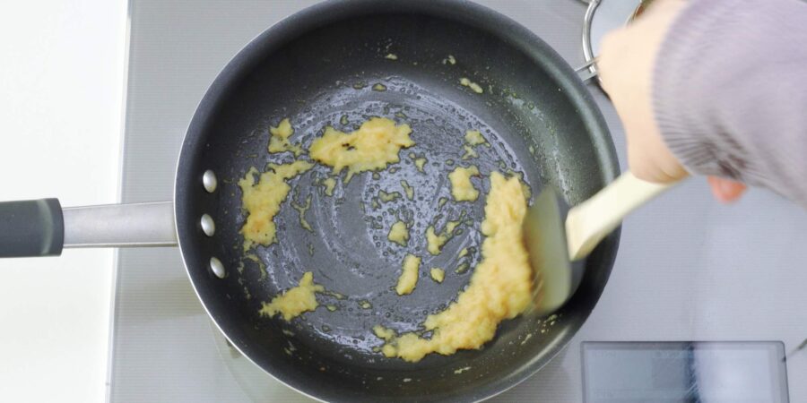 Grated onions cooking.