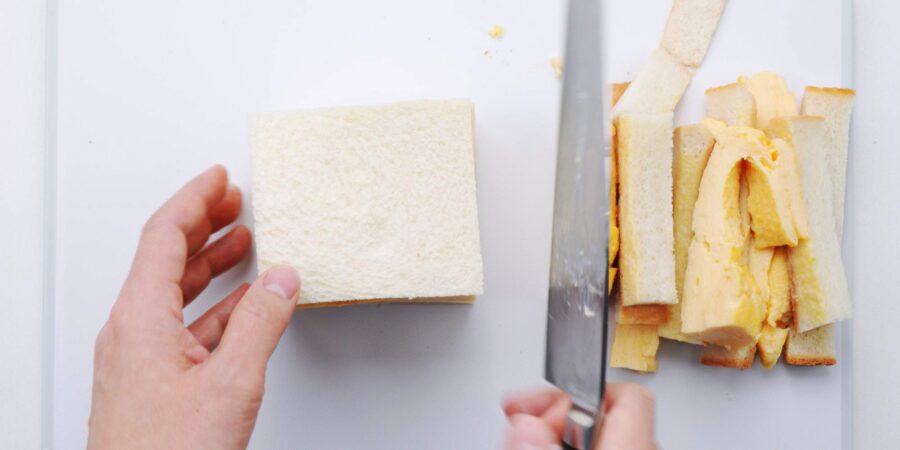 Cutting the crusts off of a Japanese Egg Sandwich.