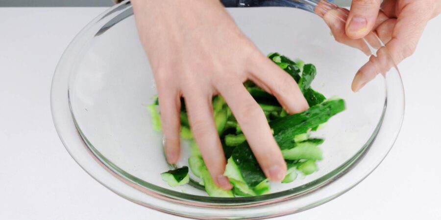 Salting smashed cucumbers.