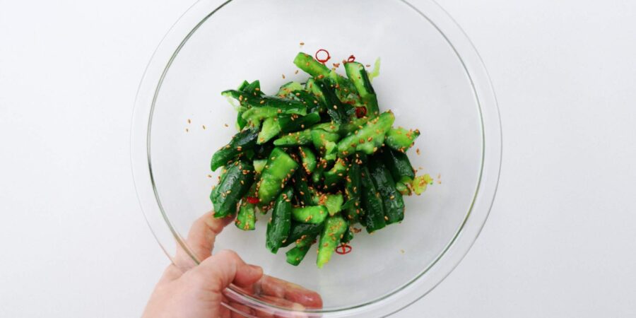 Smashed cucumbers seasoned with toasted sesame oil, soy sauce, and sesame seeds.