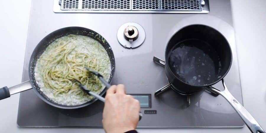Tossing spaghetti with Japanese nori cream sauce.