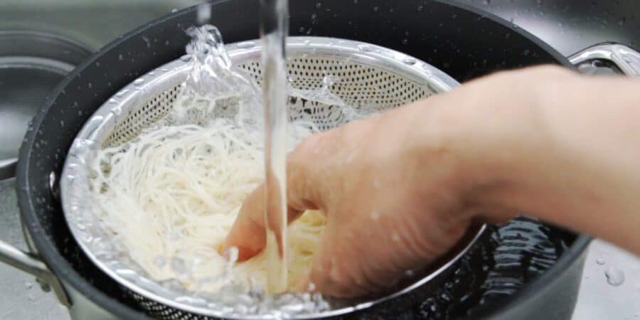 Chilling somen noodles in cold water.