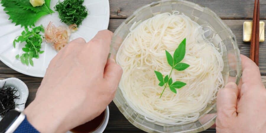 Serving somen noodles in a glass bowl with ice.