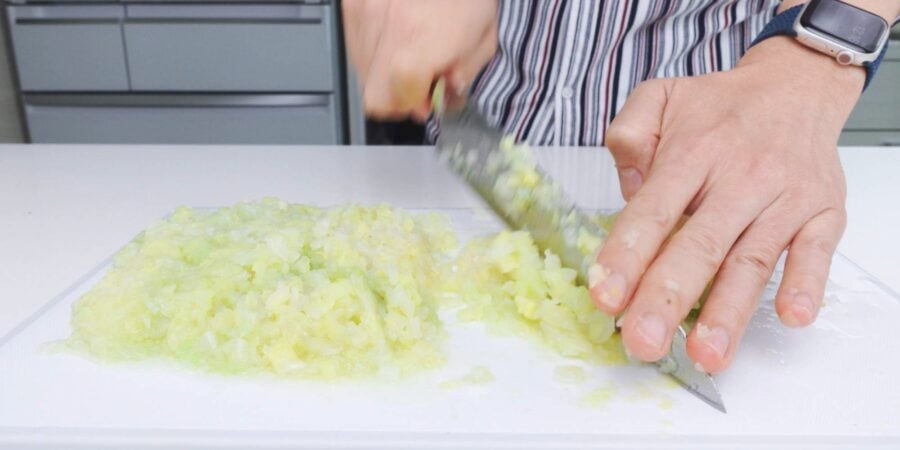 Mincing boiled cabbage for making Japanese gyoza dumplings.