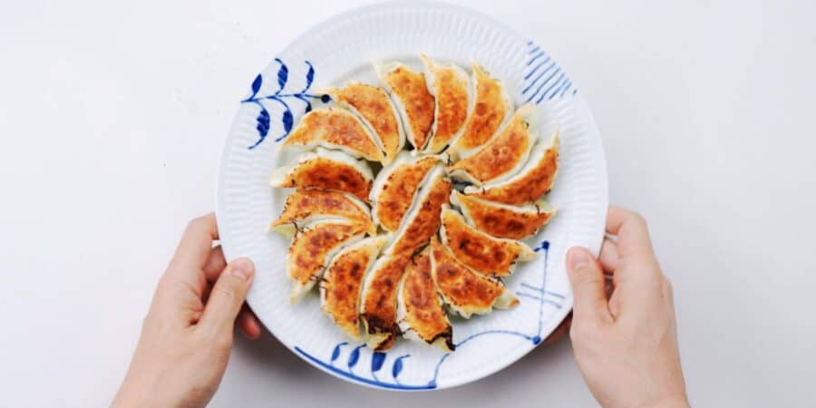 Plating gyoza with the crispy side up.