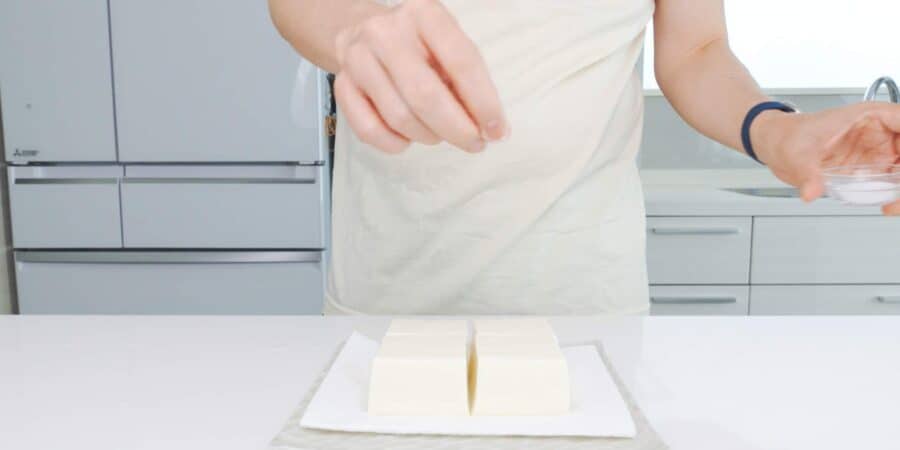 Sprinkle the tofu with salt.