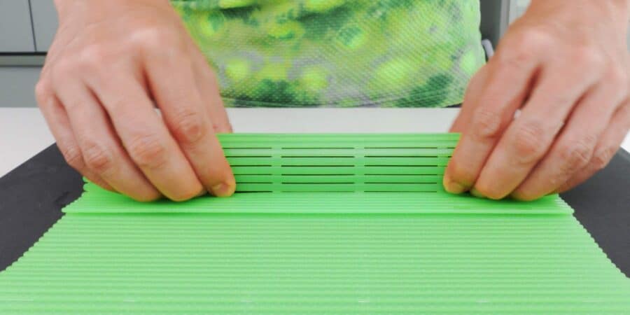 Pressing hosomaki sushi roll.