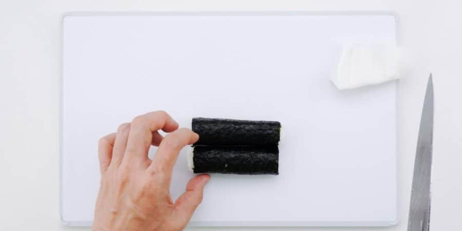 Sushi roll cut in half.
