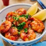 Easy shrimp rice bowl with plump juicy shrimp glazed with a decadent garlic butter-soy sauce on a bed of rice. - 7