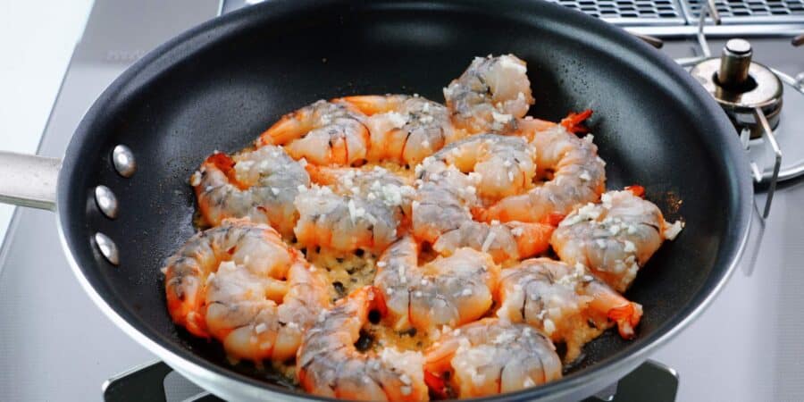 Frying the shrimp in garlic and butter