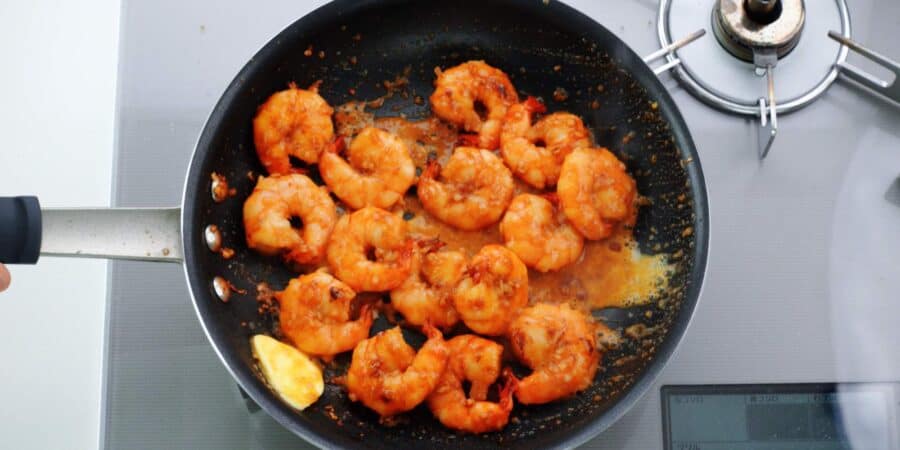 Lemon gets added to the pan.