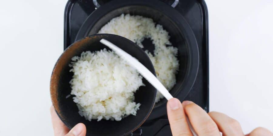 Serving rice in a rice bowl.