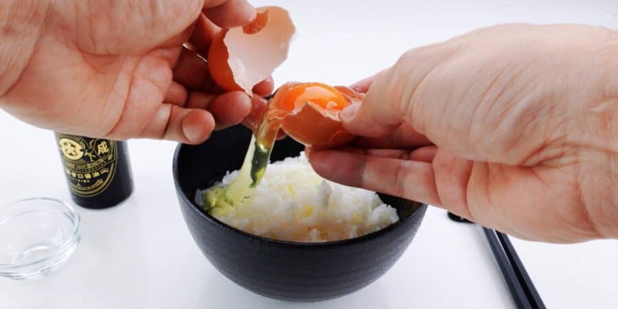 Separating egg over rice.