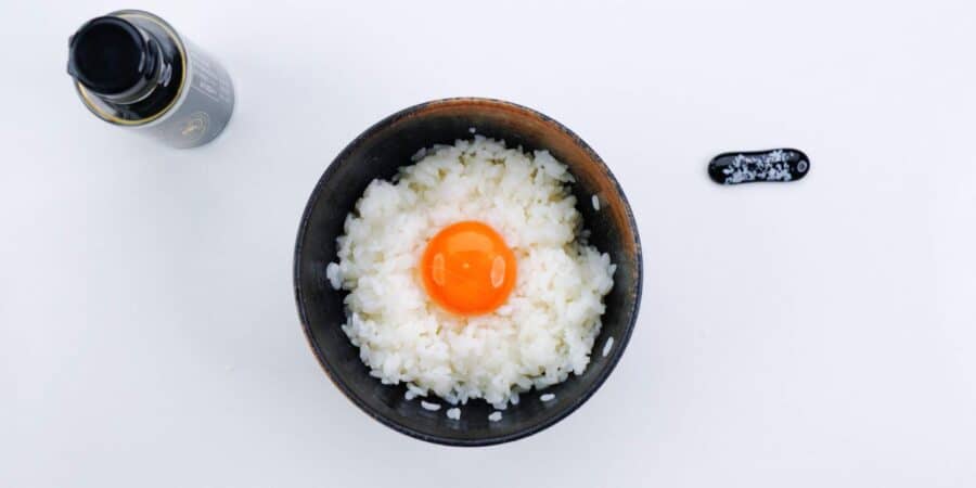 Tamagokake gohan with a raw egg yolk on top.