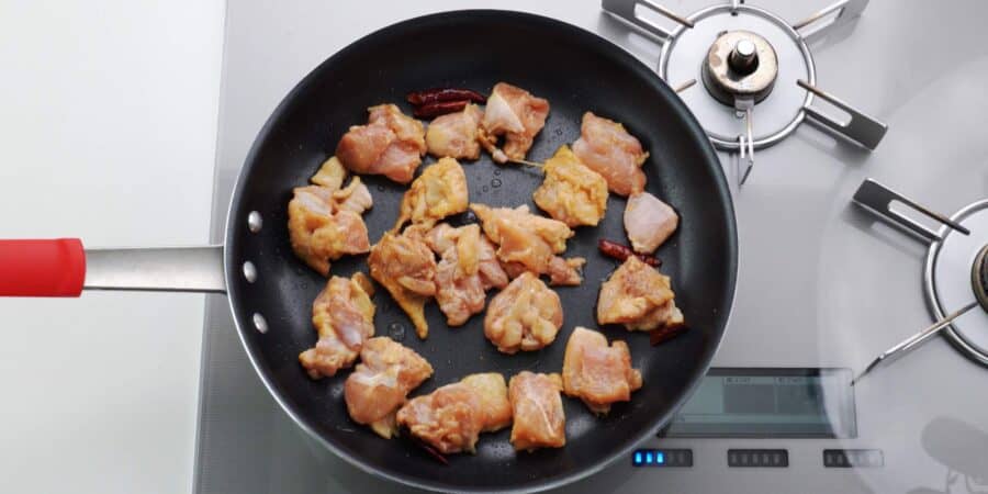Browning marinated chicken.