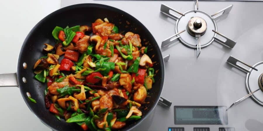Finished Hunan Chicken in a large frying pan.