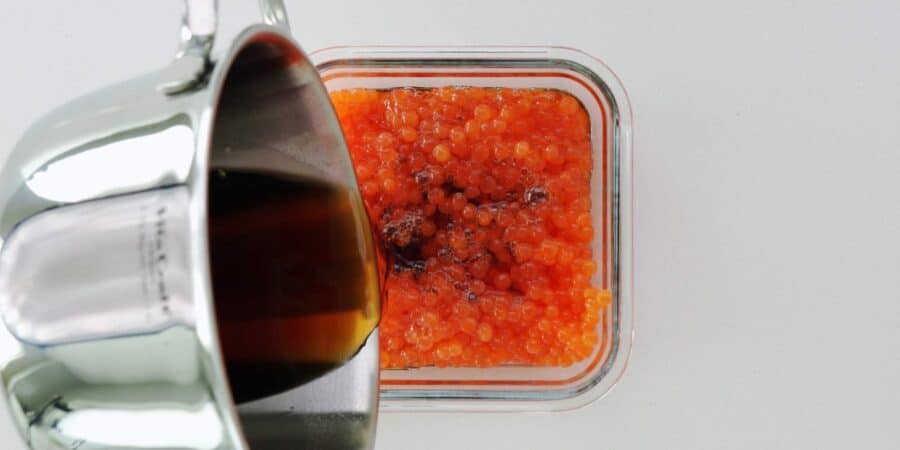 Pouring brine into ikura to cure.