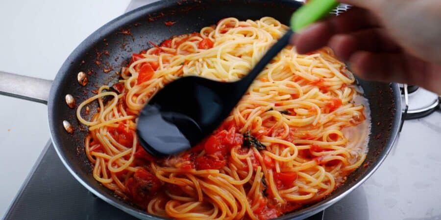 Pasta water marries the pasta and pomodoro sauce together.