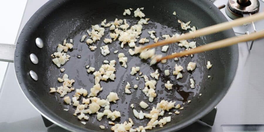 Stir-frying garlic.