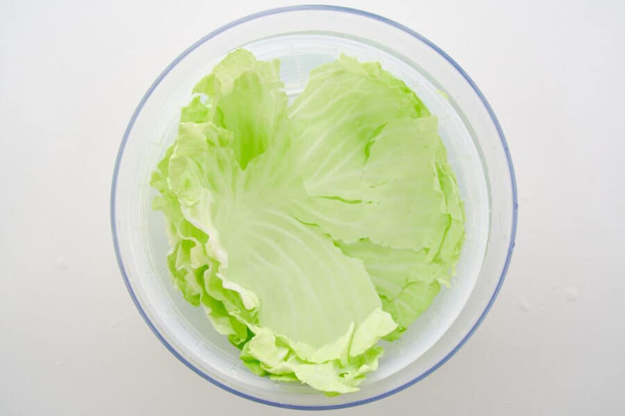 Soaking the cabbage leaves in cold water to crisp them up.