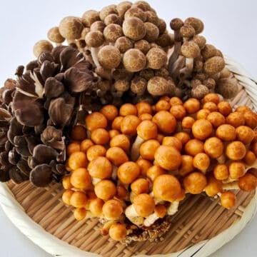 Clockwise from left: Black maitake mushrooms, shimeji mushrooms, nameko mushrooms.