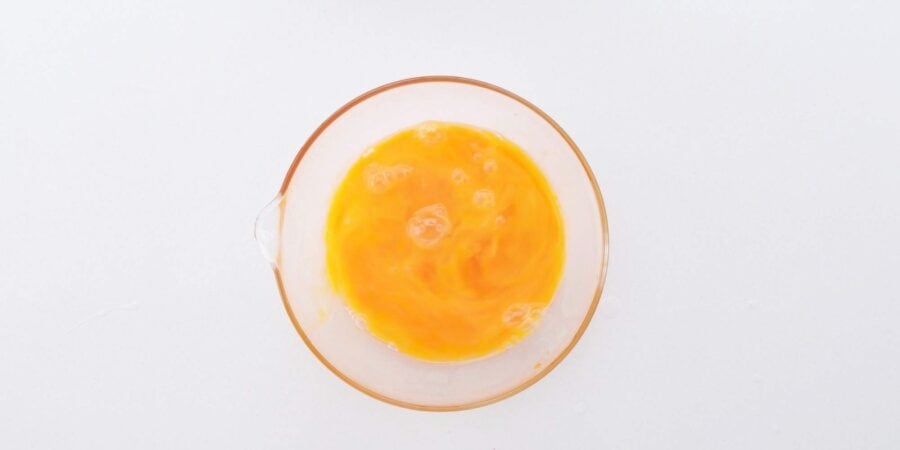 Lightly beaten egg for oyako donburi.
