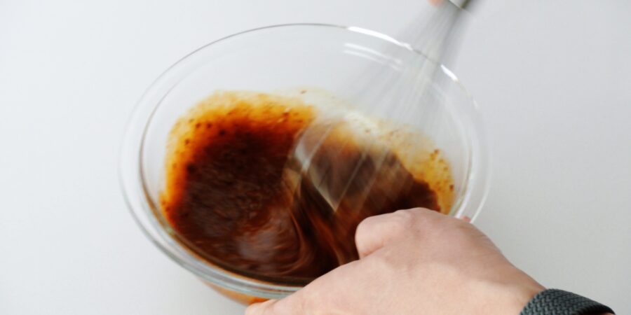 Whisking eggs and kokutou together.