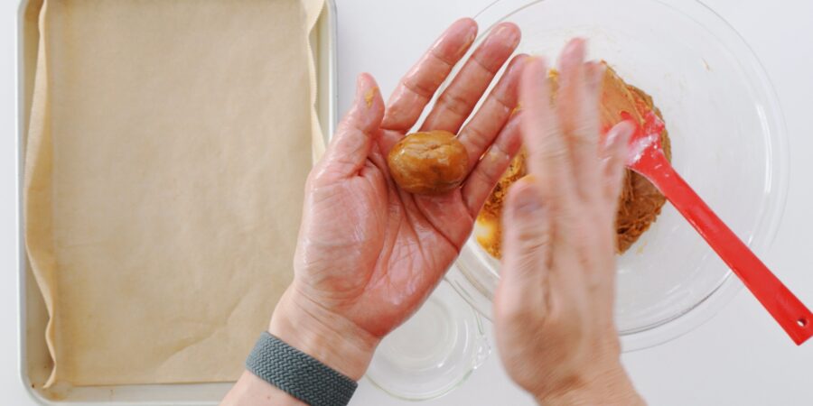 Shaping Sata Andagi into balls.