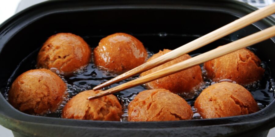 Deep fried Sata Andagi brown sugar donuts.