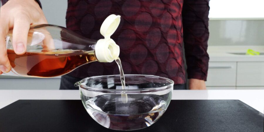 Making a bowl of tezu or "hand vinegar" for rolling sushi.