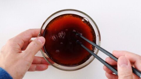 Making gyudon sauce in a glass bowl.