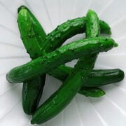 Whole Japanese pickled cucumbers glisten on a plate-crisp, refreshing, and bursting with savory umami from a simple salt brine.